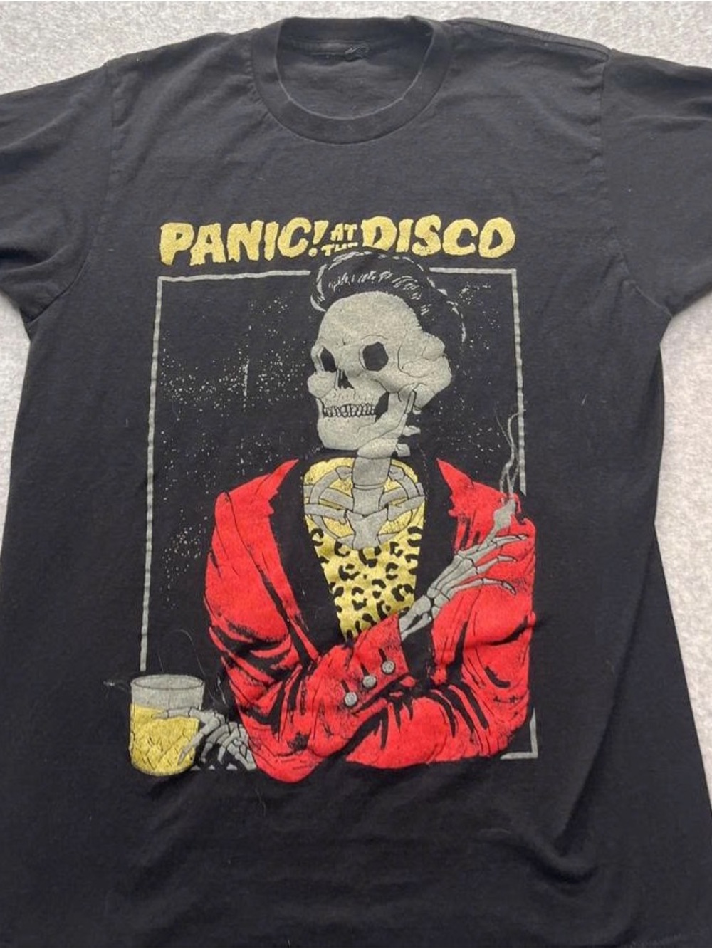 Graphic Band Tee with Red Jacket Skull Design